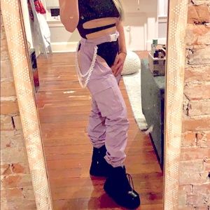 Light purple iHeartRaves chaps with white hip chains